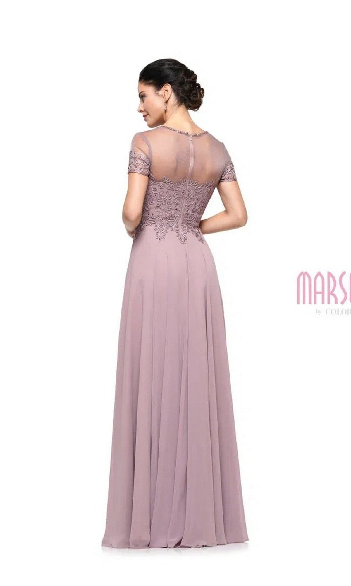 A woman stands with her back to the camera in a Marsoni M271 mauve long formal dress featuring lace details, a sweetheart neckline, sheer back panel, and chiffon pleated A-line skirt, set against a white background.